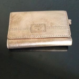 Like new rose gold metallic Fossil tri-fold wallet